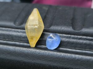 blue sapphire and a natural doubly terminated yellow sapphire crystal