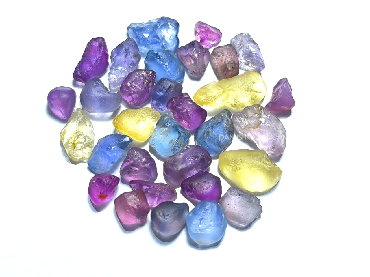 50 ct Ceylon natural unheated sapphire rough parcel with 32 pieces in pink, purple, blue, yellow, violet, lavender, and bi-color sapphire from Sri Lanka