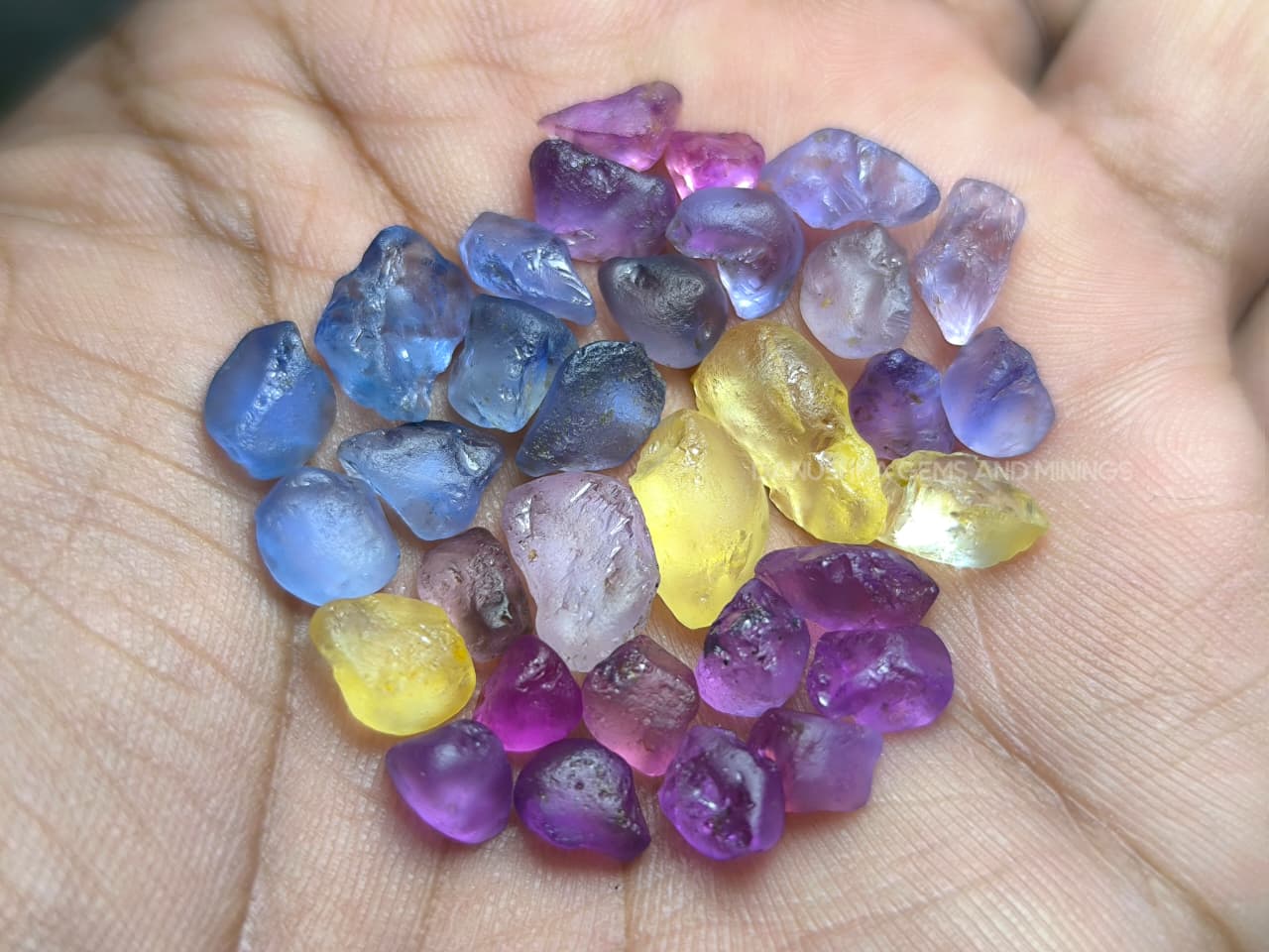 50 ct Ceylon natural unheated sapphire rough parcel with 32 pieces in pink, purple, blue, yellow, violet, lavender, and bi-color sapphire from Sri Lanka