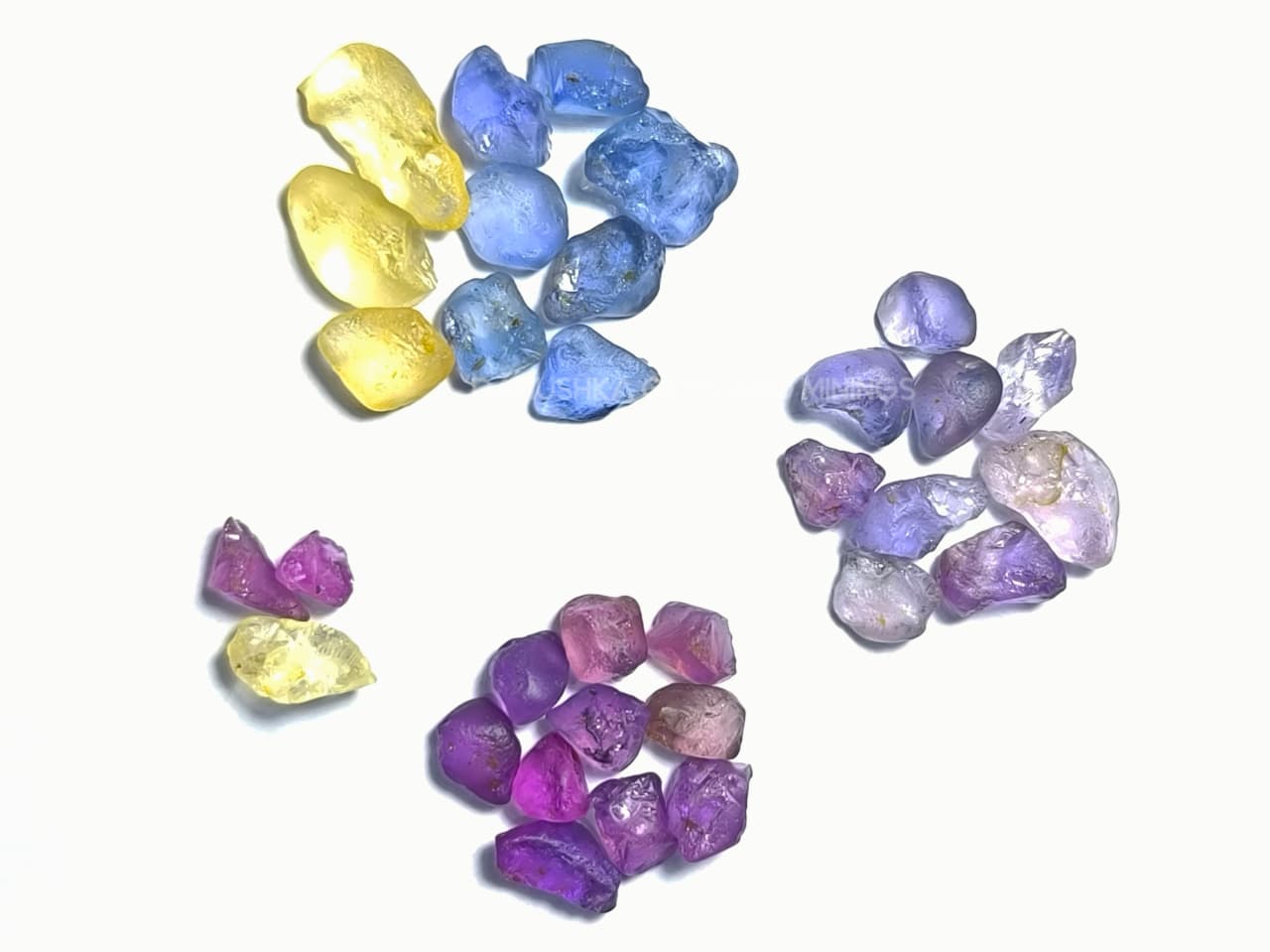 50 ct Ceylon natural unheated sapphire rough parcel with 32 pieces in pink, purple, blue, yellow, violet, lavender, and bi-color sapphire from Sri Lanka