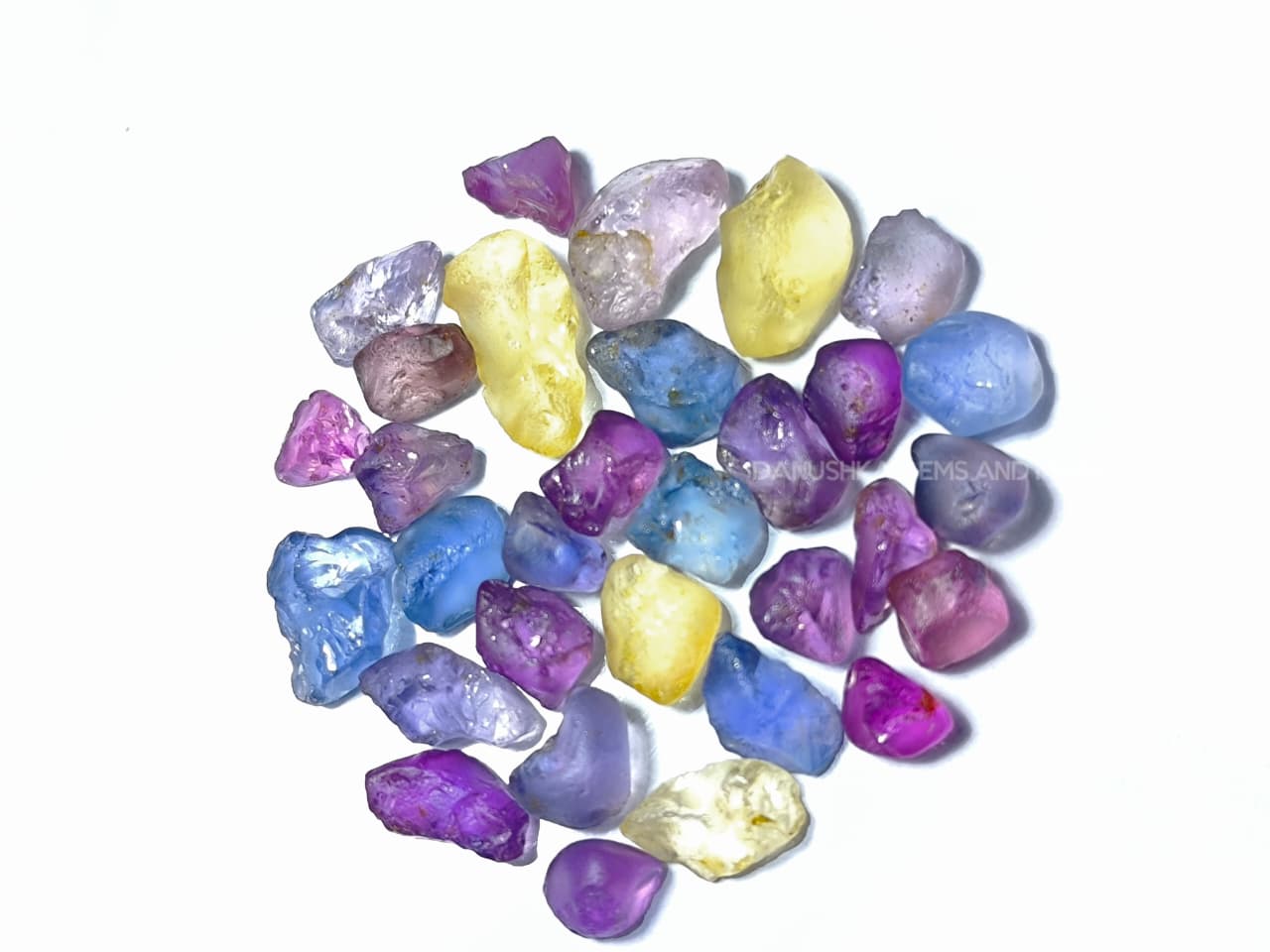 50 ct Ceylon natural unheated sapphire rough parcel with 32 pieces in pink, purple, blue, yellow, violet, lavender, and bi-color sapphire from Sri Lanka