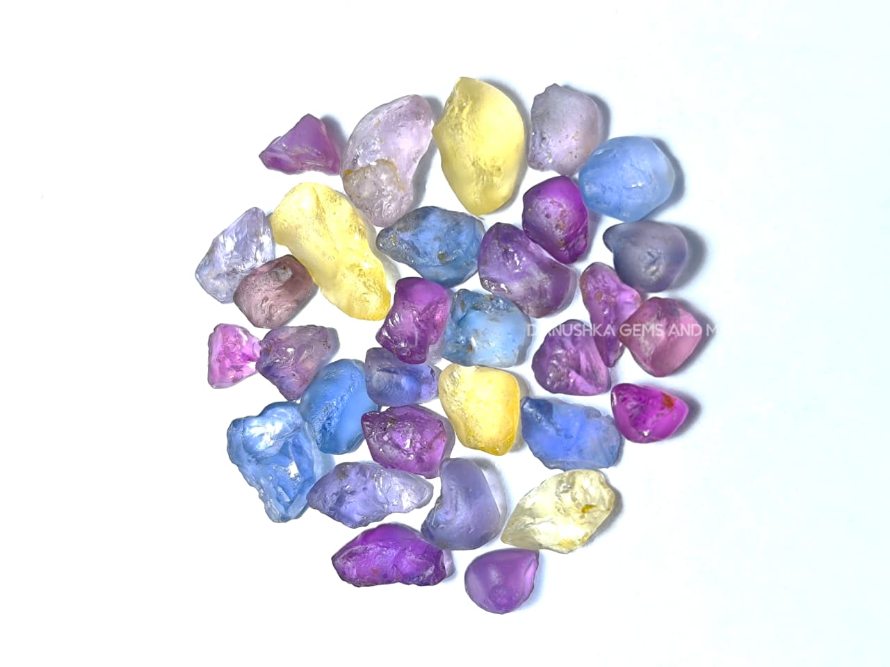 50 ct Ceylon natural unheated sapphire rough parcel with 32 pieces in pink, purple, blue, yellow, violet, lavender, and bi-color sapphire from Sri Lanka