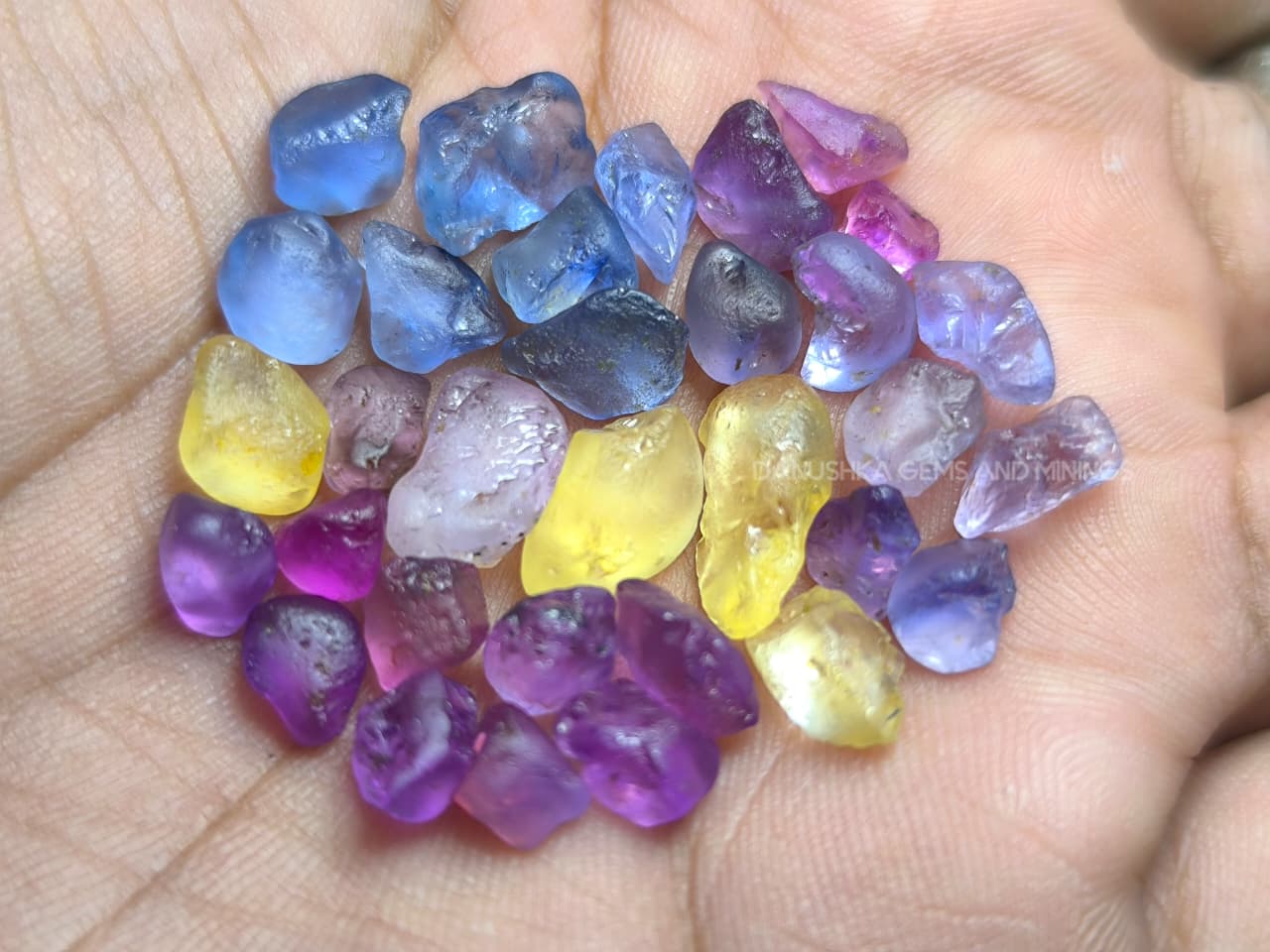 50 ct Ceylon natural unheated sapphire rough parcel with 32 pieces in pink, purple, blue, yellow, violet, lavender, and bi-color sapphire from Sri Lanka