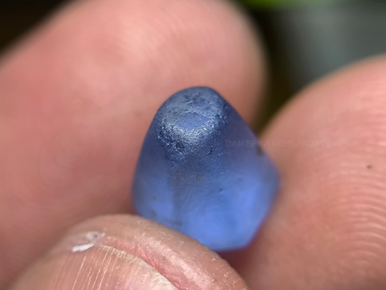 4.50 ct Ceylon Natural Unheated Blue Sapphire rough from Rakwana village around mining in Sri Lanka with visible internal features and cutting potential.