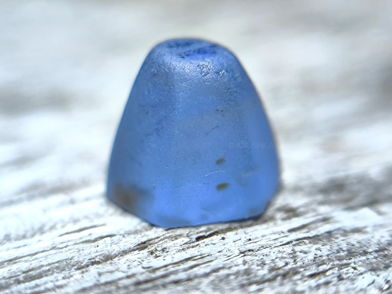 4.50 ct Ceylon Natural Unheated Blue Sapphire rough from Rakwana village around mining in Sri Lanka with visible internal features and cutting potential.