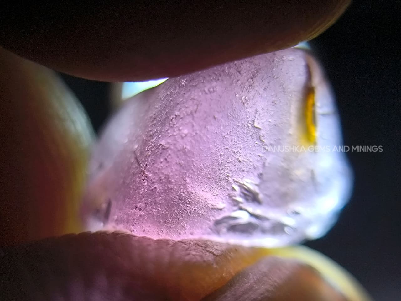 Three-piece facet-grade Spinel rough parcel with color-change, purplish pink, and blue Spinel stones showing natural inclusions and cutting potential.