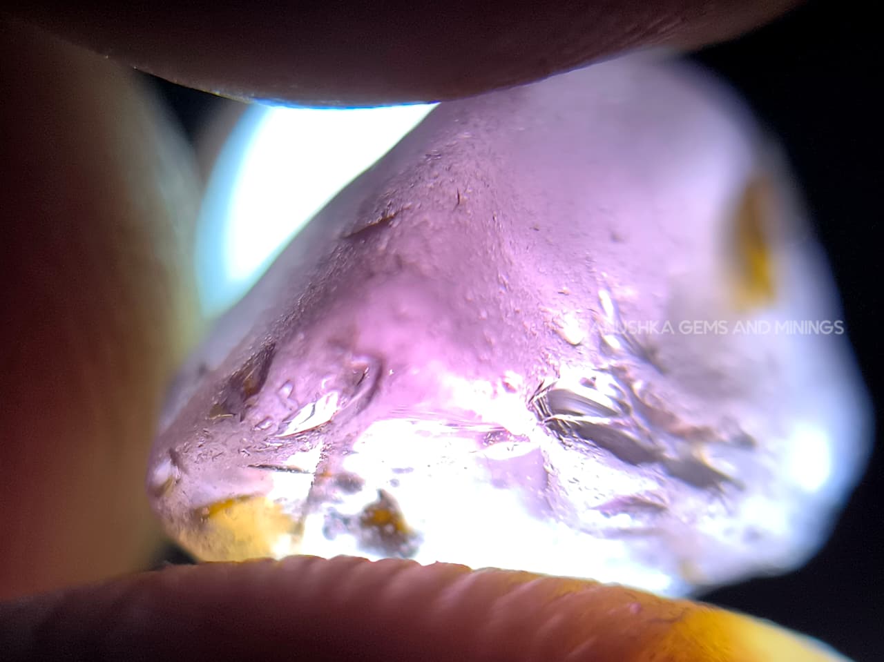 Three-piece facet-grade Spinel rough parcel with color-change, purplish pink, and blue Spinel stones showing natural inclusions and cutting potential.
